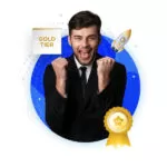 A man in a suit celebrating with a joyful expression, fists raised in excitement. Behind him is a circular blue background with a rocket and a gold medal symbolizing coding or development. A "Gold Tier" badge is displayed at the top left.